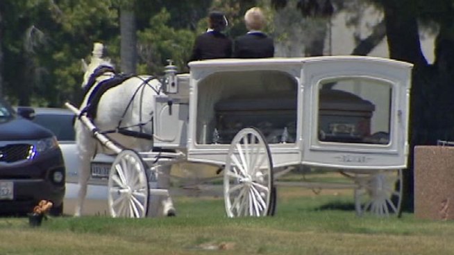 Unique Russell was mourned at a funeral Saturday at Inglewood Cemetery. She died at age 14 after being shot by unknown assailants during a family July 4 celebration near South Los Angeles. Ted Chen reports from Inglewood for the NBC4 News at 6 p.m. on July 14, 2012.