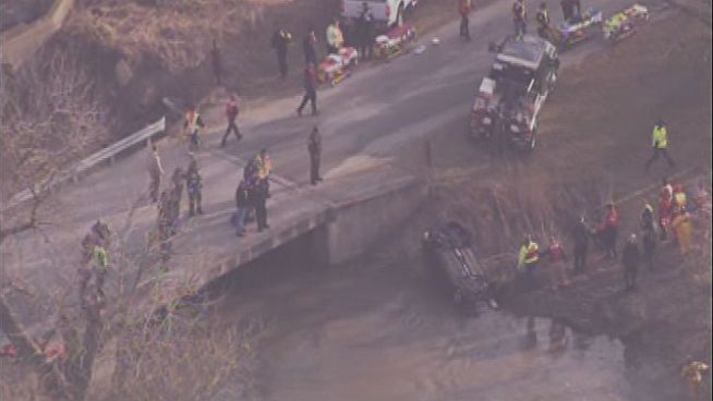 Crews pull a car from Forked Creek in Will County after it plunged into the water overnight. Four teens reportedly were killed in the crash.