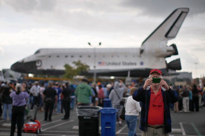 A crowd gathered Friday in a Westchester parking lot, the first stop for Endeavour on the space shuttle's 12-mile journey to the California Science Center. Shuttle groupies explain why the spectacle is a must-see. Toni Guinyard reports for the NBC4 News at noon on Oct. 12, 2012.