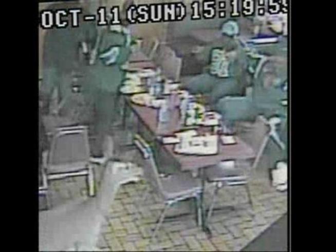 Customers at a restaurant are stunned when a deer runs through their diner and out the front door.