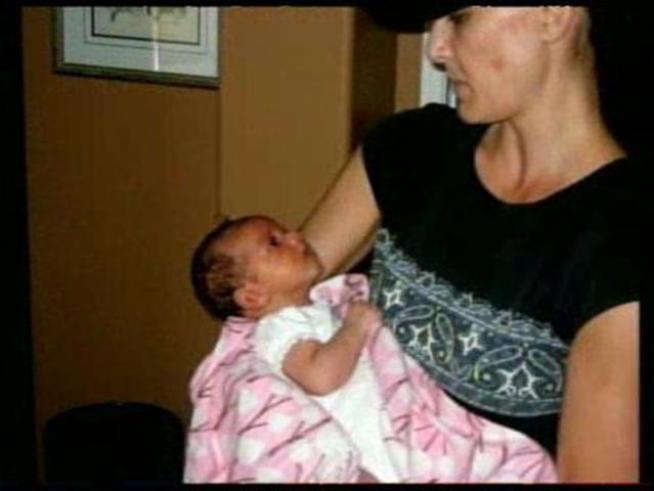 A toddler is caught in a tug of war as the battle intensifies between the <a title=