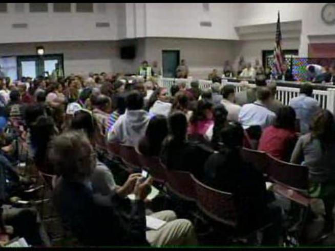 Even before they were seated, the council heard boos from residents.