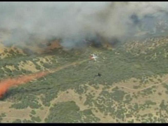 Firefighters battle a brush fire near Lebec in <a title=
