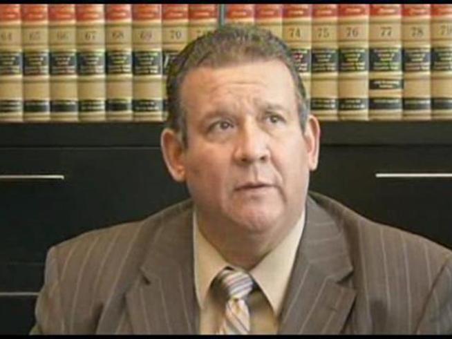 One of the four Bell City Council members charged with illegally paying themselves and others in the modest Los Angeles suburb huge salaries has resigned.