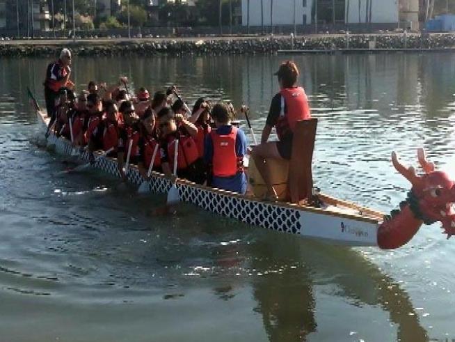 A boat filled with blind paddlers is taking to the water.
