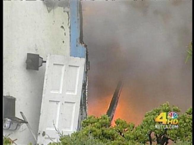 A fighter jet taking part in a training mission crashes near Interstate 805 in <a title=