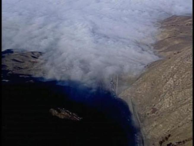 Heavy fog covers the grapevine, preventing rescue crews from flying to the scene of a car crash.