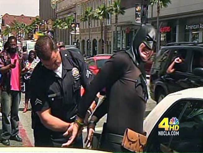 Batman's utility belt is not match for a set of handcuffs. 