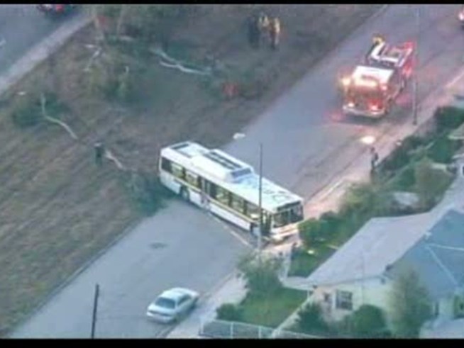 A street is left in chaos and at least one person is killed in a runaway bus crash in Carson.