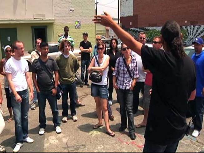 The tour takes bus passengers through South Central, <a title=