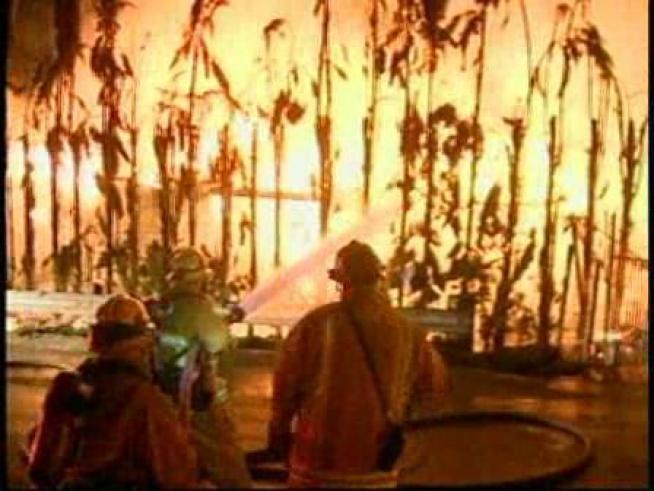 Firefighters work to control a house fire in La Habra Heights.