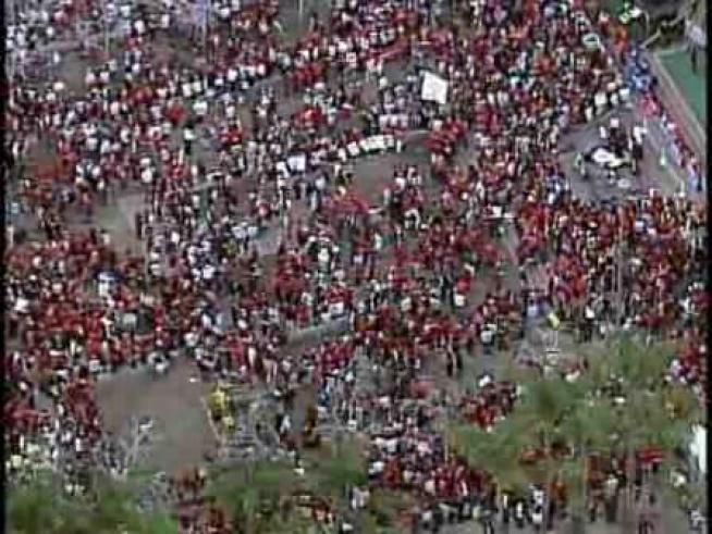 Thousands of teachers march through downtown Los Angeles to protest anticipated cuts in education funding and the possibility of teacher layoffs.