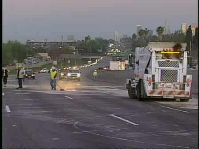 Emergency crews respond to an overturned big-rig on the 5 Freeway.