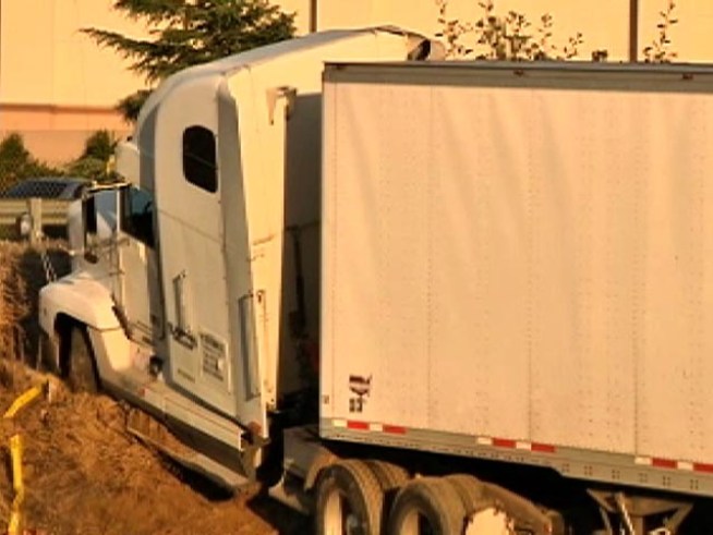 Trucker Killed; Suspects in Custody