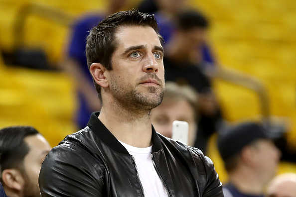 In this June 17, 2017, file photo, quarterback Aaron Rodgers of the Green Bay Packers watches warm-ups before the Golden State Warriors take on the Cleveland Cavaliers in Game 5 of the 2017 NBA Finals at ORACLE Arena in Oakland, California.