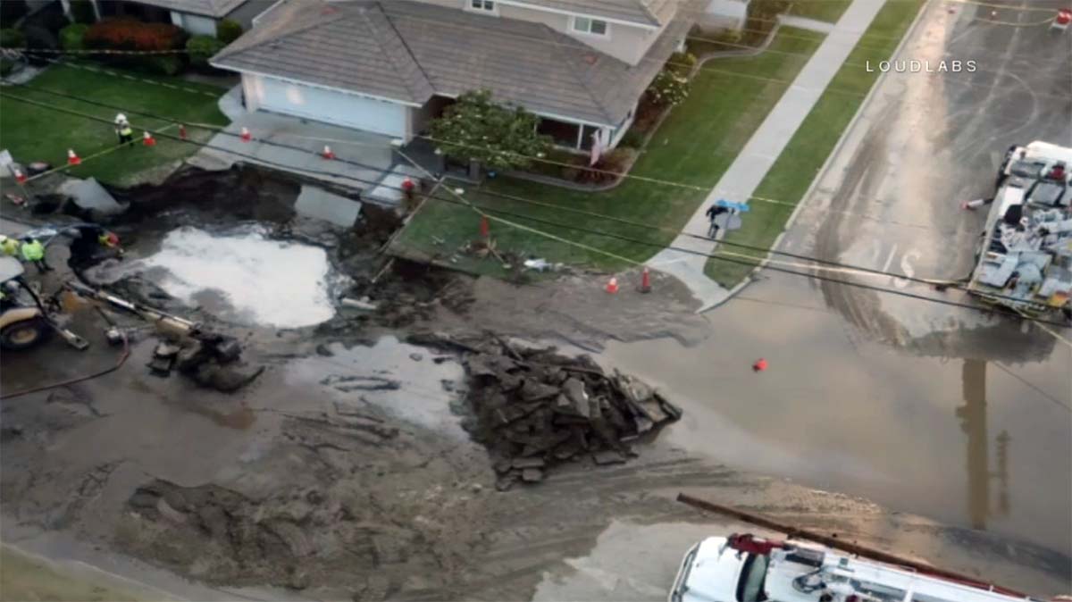Sinkhole Opens in Front of Downey Home After Crash That Knocked Out