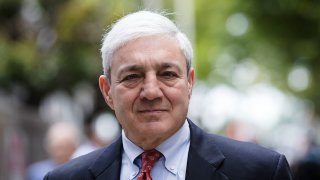 In this June 2, 2017 file photo, former Penn State President Graham Spanier departs after his sentencing hearing at the Dauphin County Courthouse in Harrisburg, Pa