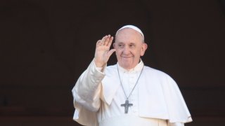 In this Dec. 25, 2019, file photo, Pope Francis waves to the faithful as he arrives to deliver the Urbi et Orbi (Latin for "to the city and to the world") Christmas day blessing from the main balcony of St. Peter's Basilica at the Vatican.