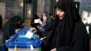 A woman votes in the Iranian election.