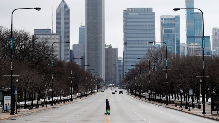 Woman walks across a road in Illinois