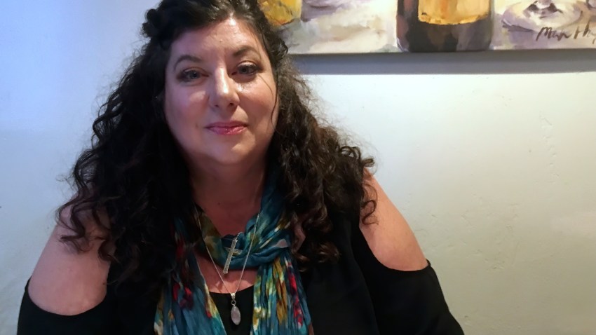 In this April 4, 2019, photo Tara Reade poses for a photo during an interview with The Associated Press in Nevada City, Calif.