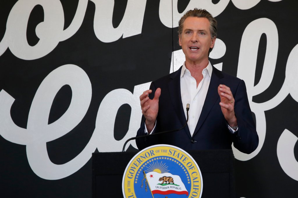Gov. Gavin Newsom discusses his plan for the gradual reopening of California businesses during a news conference at the Display California store in Sacramento, Calif., Tuesday, May 5, 2020.