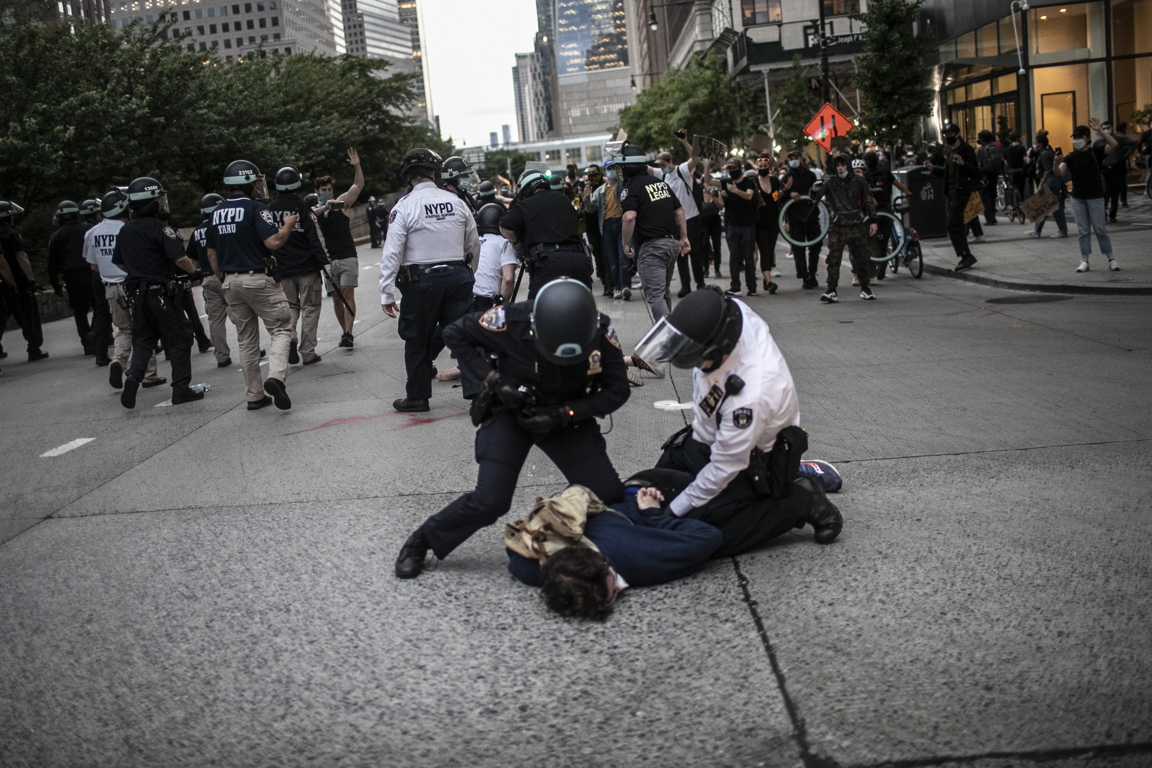 Police arrest protesters defying an imposed curfew during a march to protest police brutality in the wake of George Floyd’s death, June 2, 2020, in New York. Floyd died after being restrained by Minneapolis police officers on May 25.