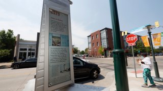 A tablet offers the recent history of the Stapleton neighborhood at the intersection of 29th Avenue and Roslyn Street, Wednesday, June 17, 2020, in northeast Denver.