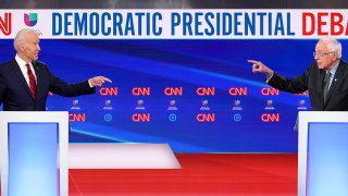 Democratic presidential hopefuls Joe Biden and Bernie Sanders point fingers during the 11th Democratic 2020 presidential primary debate in a CNN studio, March 15, 2020, in Washington, D.C.
