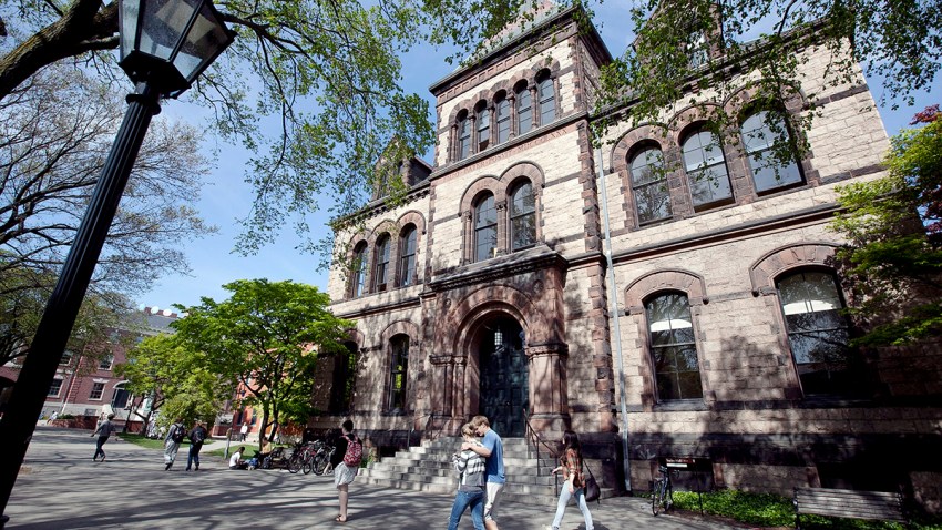 FILE - In this May 7, 2012 file photo, people walk past Sayles Hall on the campus of Brown University, in Providence, R.I.