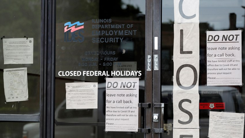 Information signs are posted at the Illinois Department of Employment Security office, June 5, 2020, in Chicago.