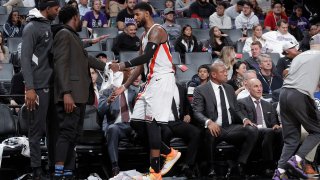 Paul George #13 of the LA Clippers high-fives his teammates during a game against the Sacramento Kings on December 31, 2019 at Golden 1 Center in Sacramento, California. (Photo by Rocky Widner/NBAE via Getty Images)