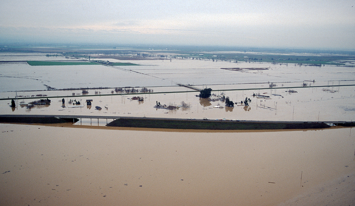 The massive Northern California flood in early January 1997, forced a break on the east levee of the Feather River at the west end of Country Club Road near the community of Arboga in Yuba County, California. This photo taken Jan. 4, 1997, looks east onto Highway 70 southeast from Country Club Road. At left is the Plumas Arboga Road and railway overpass; at right, the Algodon Road overpass.