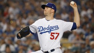 Pitcher Alex Wood #57 of the Los Angeles Dodgers pitches in the ninth inning of Game Four of the 2018 World Series against the Boston Red Sox at Dodger Stadium on October 27, 2018 in Los Angeles, California.