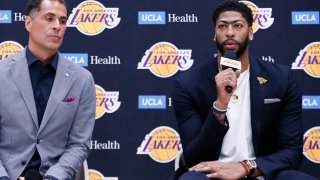 General Manager Rob Pelinka and Anthony Davis #3 of the Los Angeles Lakers speak to the media during a press conference.