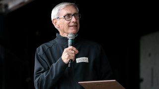 Wisconsin Gov. Tony Evers speaks to the crowd during the 48th Annual Juneteenth Day Festival on June 19, 2019, in Milwaukee.