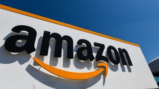 This July 23, 2019, file photo shows the Amazon logo at the entrance area of the Amazon logistics centre in Amiens, northern France.