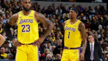 LeBron James #23, and Kentavious Caldwell-Pope #1 of the Los Angeles Lakers looks on during the game against the Indiana Pacers on December 17, 2019 at Bankers Life Fieldhouse in Indianapolis, Indiana.