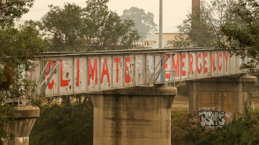 Graffiti is seen on a bridge on Jan. 3, 2020, in Bairnsdale, Australia. The HMAS Choules docked outside of Mallacoota this morning to evacuate thousands of people stranded in the remote coastal town following fires across East Gippsland, which have killed one person and destroyed dozens of properties.