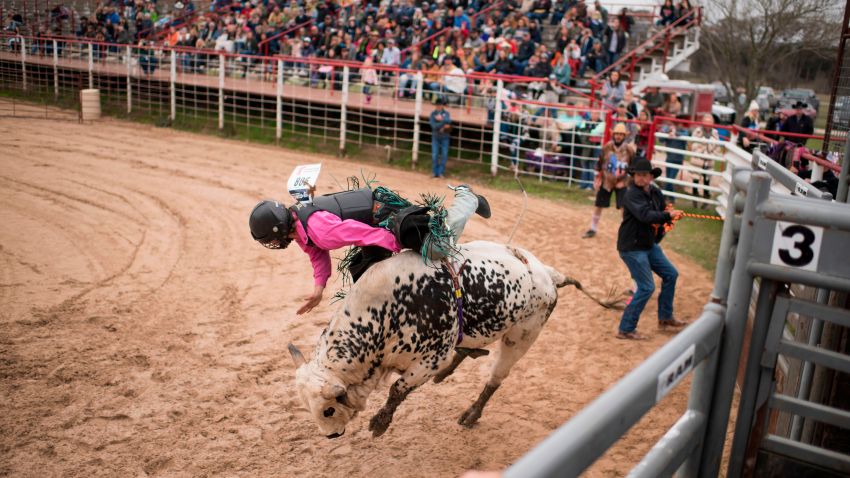 File photo - Tyler Fender, 17, is bucked off a bull during the Cowboy Mardi Gras Bull Riding and Mini Bull Riding Competition in Bandera, Texas, on Feb. 15, 2020.