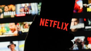 In this photo illustration a Netflix logo seen displayed on a smartphone.
