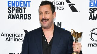 In this Feb. 8, 2020, file photo, Adam Sandler, winner of Best Male Lead for "Uncut Gems," poses in the press room at the 2020 Film Independent Spirit Awards in Santa Monica, California.