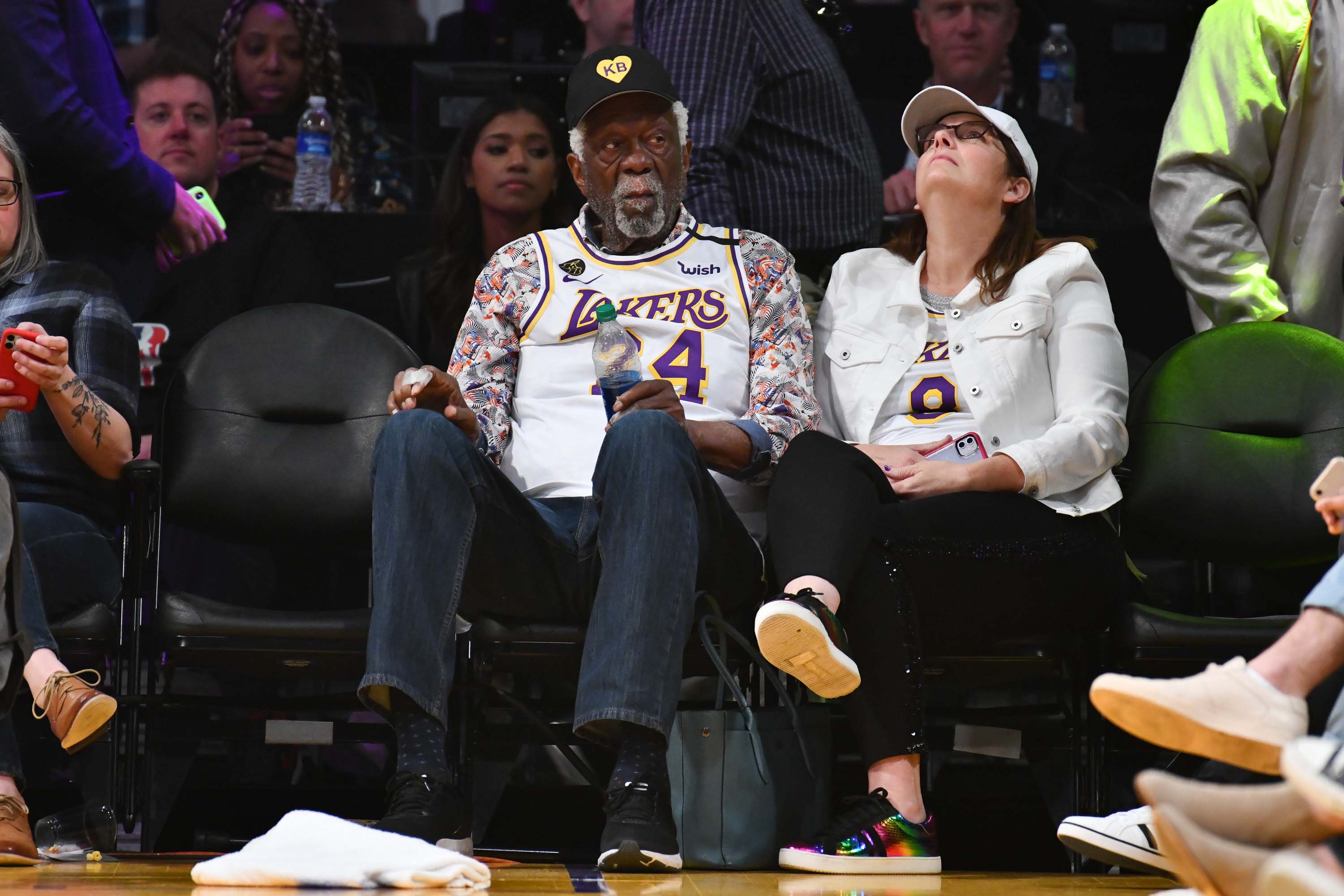 Singer Geri Horner, also known as Ginger Spice, center, sits with her  husband, Christian Horner, right, and Los Angeles Lakers owner Jeanie Buss  during the second half of an NBA basketball game against the San Antonio  Spurs, Monday, Oct. 22, 2018, in