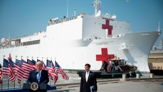US President Donald Trump, with Defense Secretary Mark Esper in front of the USNS Comfort ship