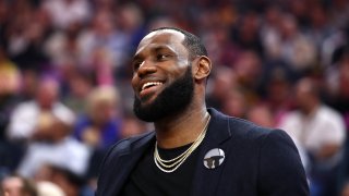 LeBron James of the Los Angeles Lakers sits on the bench injured during their game against the Golden State Warriors at Chase Center on Feb. 27, 2020 in San Francisco.