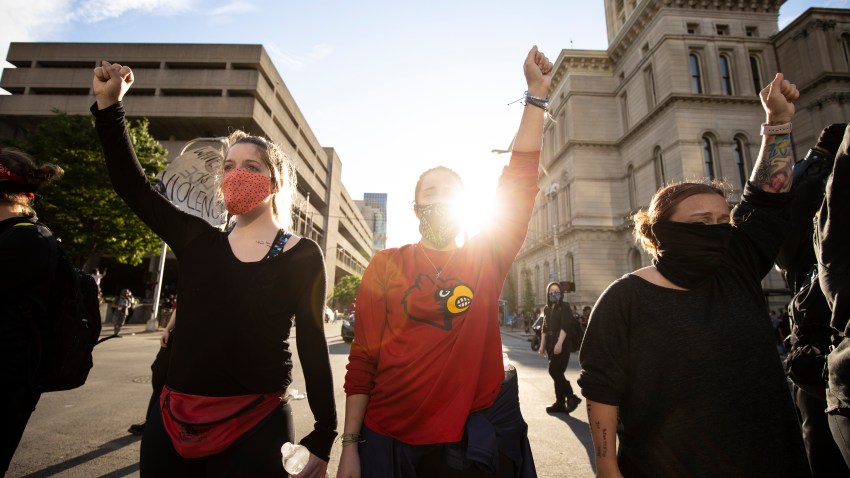 In this May 29, 2020, file photo, protesters gather outside of City Hall after a peaceful march across the city in Louisville, Kentucky.