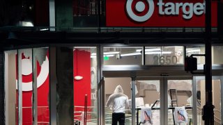Looters rob a Target store as protesters face off against police in Oakland California