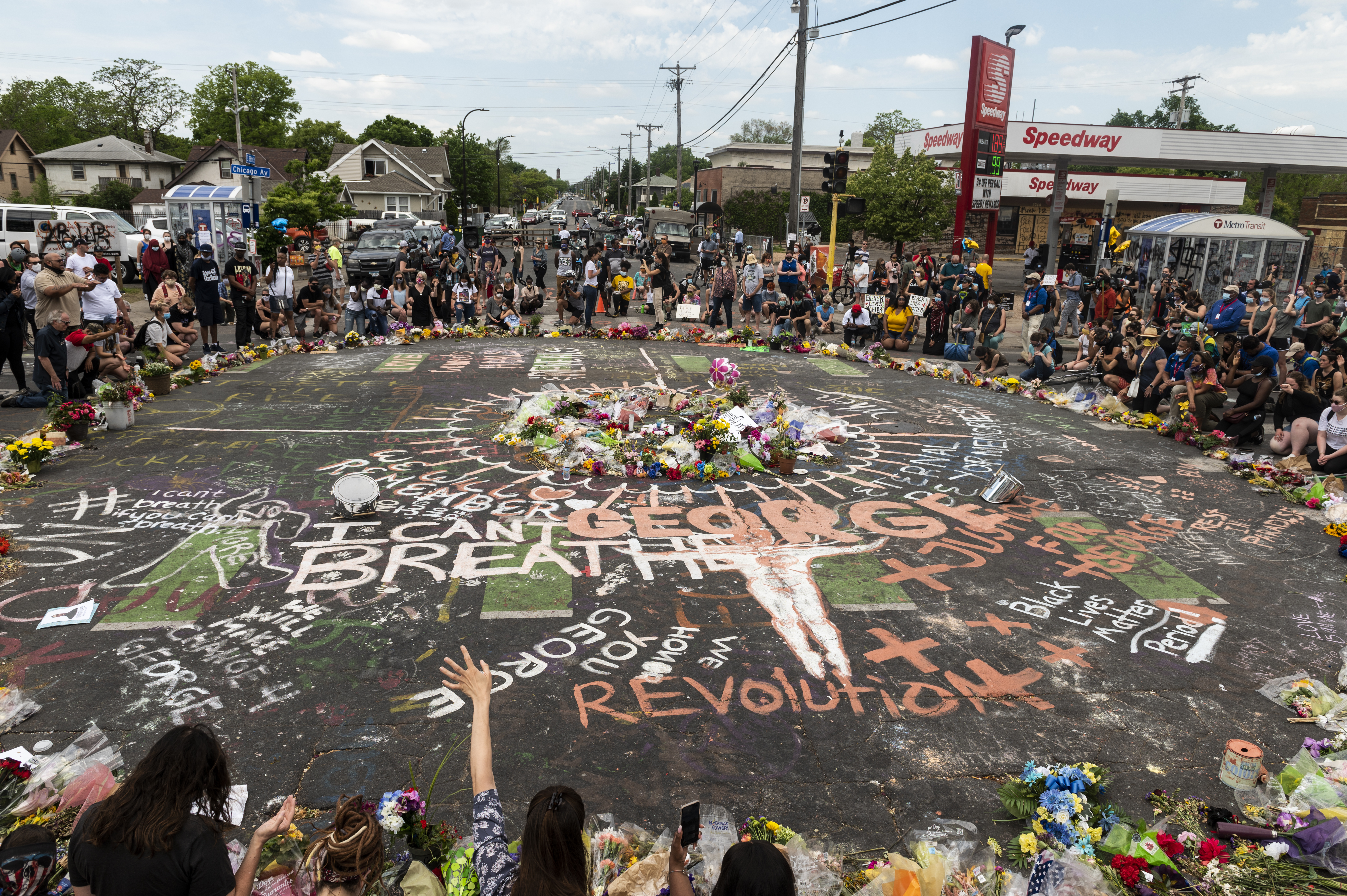 People gather at site where George Floyd died May 25 while in police custody, on June 1, 2020, in Minneapolis, Minnesota. George’s brother Terrence Floyd visited the site today and called for justice and the prosecution of all four officers involved in the incident.