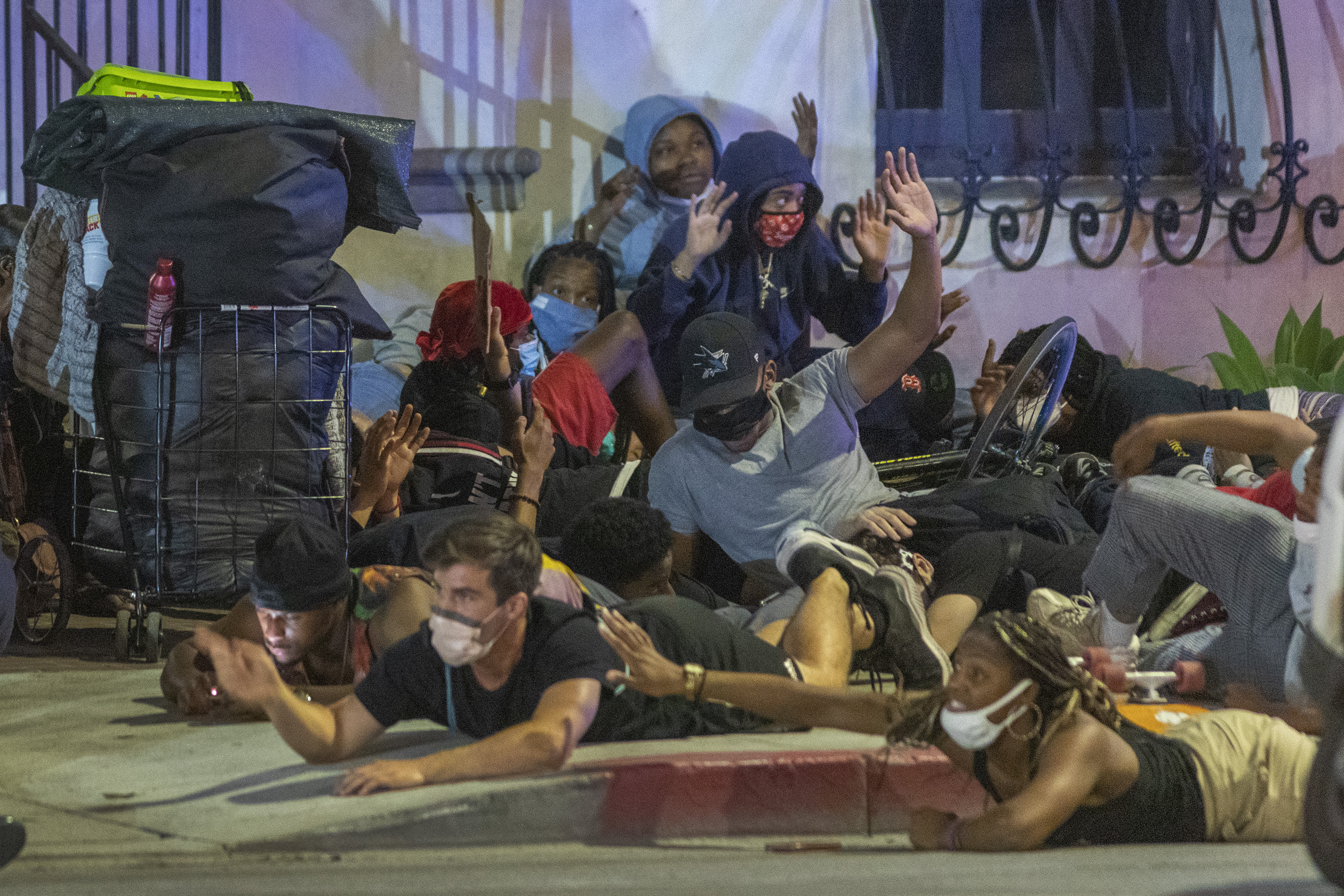 Less-than-lethal rifle rounds are fired near protesters and motorists surrounded by police as large numbers of people are arrested after a curfew went into effect on June 2, 2020, in Los Angeles. The vast majority of protestors demonstrated peacefully.