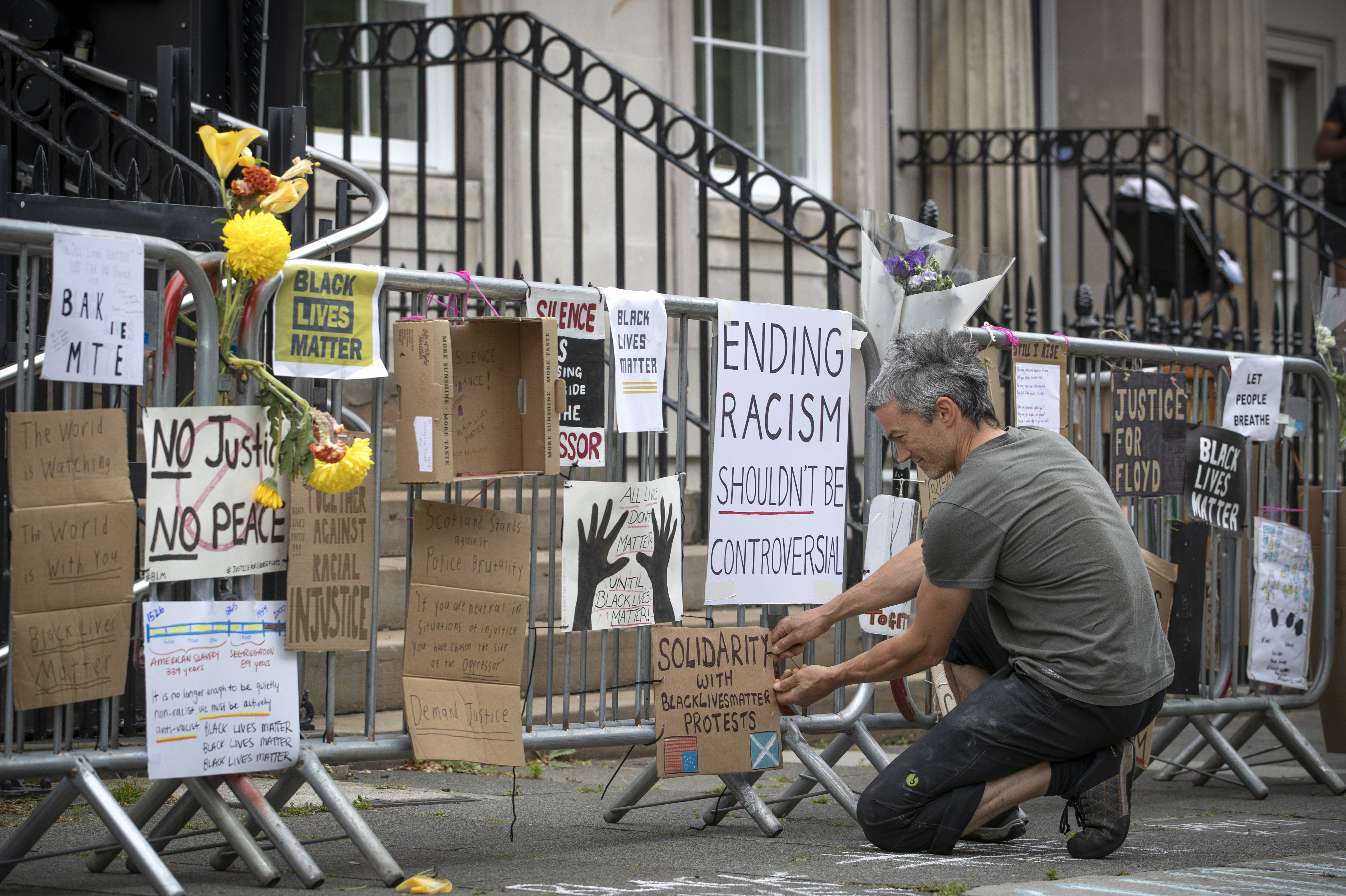 Posters drawn in protest of George Floyd’s death is posted outside the U.S. Consulate General office in Edinburgh.